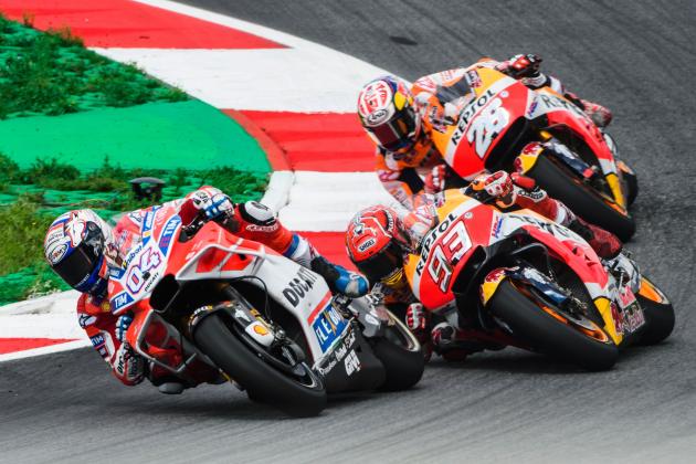 (From L) Ducati Team's Italian rider Andrea Dovizioso, Repsol Honda Team's Spanish rider Marc Marquez, Repsol Honda Team's Spanish rider Dani Pedrosa compete during the MotoGP Austrian Grand Prix race at Red Bull Ring in Spielberg, Austria on August 13, 2017. / AFP PHOTO / Jure Makovec        (Photo credit should read JURE MAKOVEC/AFP/Getty Images)