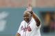 Former Atlanta Braves' Hank Aaron is honored during a ceremony before a baseball game between the Braves and the San Diego Padres in Atlanta, Friday, April 14, 2017. The Braves are playing their first regular-season game in SunTrust Park, the new suburban stadium that replaced Turner Field. (AP Photo/John Bazemore)