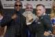 Floyd Mayweather Jr., left, and Conor McGregor pose for photographers during a news conference Wednesday, Aug. 23, 2017, in Las Vegas. The two are scheduled to fight in a boxing match Saturday in Las Vegas. (AP Photo/John Locher)