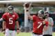 Jacksonville Jaguars quarterback Blake Bortles (5) looks on as quarterback Chad Henne (7) throws a pass during practice at NFL football training camp, Wednesday, Aug. 5, 2015, in Jacksonville, Fla. (AP Photo/John Raoux)