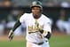 OAKLAND, CA - AUGUST 10: Rajai Davis #11 of the Oakland Athletics scores on a sacrifice fly from Jed Lowrie #8 against the Baltimore Orioles in the bottom of the first inning at Oakland Alameda Coliseum on August 10, 2017 in Oakland, California. (Photo by Thearon W. Henderson/Getty Images)