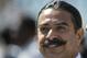 FILE - In this Oct. 19, 2014, file photo, Jacksonville Jaguars team owner Shad Khan watches players warm up before an NFL football game against the Cleveland Browns in Jacksonville, Fla. Shad Khan expects to sign a long-term deal to continue playing annually in London. If Khan gets his way, it will be a 14-year commitment. Speaking at a kickoff luncheon Tuesday, Sept. 1, 2015, Khan said he’s “optimistic, obviously, that we’ll have a renewal on (London) and it will go for a long time.”(AP Photo/Stephen B. Morton, File)