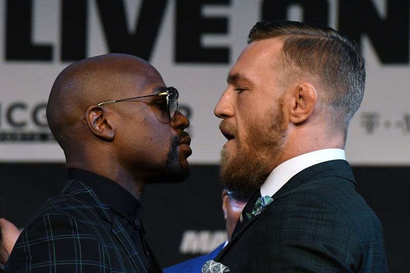 LAS VEGAS, NV - AUGUST 23: Boxer Floyd Mayweather Jr. (L) and UFC lightweight champion Conor McGregor face off during a news conference at the KA Theatre at MGM Grand Hotel & Casino on August 23, 2017 in Las Vegas, Nevada. The two will meet in a super welterweight boxing match at T-Mobile Arena on August 26 in Las Vegas. (Photo by Ethan Miller/Getty Images)