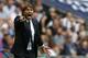 Chelsea's Italian head coach Antonio Conte gestures during the English Premier League football match between Tottenham Hotspur and Chelsea at Wembley Stadium in London, on August 20, 2017. / AFP PHOTO / IKIMAGES AND AFP PHOTO / Ian KINGTON / RESTRICTED TO EDITORIAL USE. No use with unauthorized audio, video, data, fixture lists, club/league logos or 'live' services. Online in-match use limited to 45 images, no video emulation. No use in betting, games or single club/league/player publications. (Photo credit should read IAN KINGTON/AFP/Getty Images)