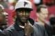 FILE - In this Jan. 1, 2017, file photo, former Atlanta Falcons quarterback Michael Vick stands on the sidelines before NFL football game between the Falcons and the New Orleans Saints in Atlanta. Vick never made it to the Super Bowl with the Falcons. And his career with the team ended in disgrace. Yet no one is rooting harder for the Falcons to win their first championship.(AP Photo/John Bazemore, File)