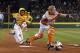 Lufkin, Texas catcher Chandler Spencer, right, can't handle the throw from first baseman Mark Requena, allowing Greenville, N.C.'s Cash Daniels-Moye to score on a walk-off fielder's choice by Thomas Barrett in the seventh inning of a baseball game in United States pool play at the Little League World Series tournament in South Williamsport, Pa., Wednesday, Aug. 23, 2017. North Carolina won 2-1. (AP Photo/Gene J. Puskar)