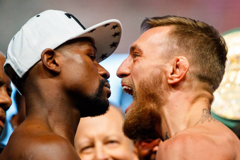 Aug 25, 2017; Las Vegas, NV, USA; Conor McGregor (right) screams in the face of Floyd Mayweather during weigh ins for the upcoming boxing match at T-Mobile Arena. Mandatory Credit: Mark J. Rebilas-USA TODAY Sports