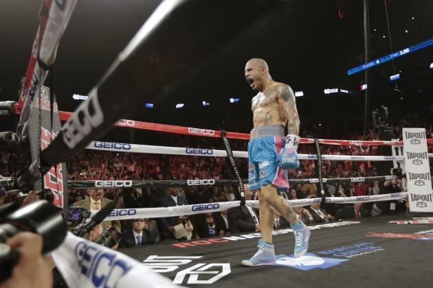 Miguel Cotto, of Puerto Rico, celebrates after defeating Daniel Geale, of Australia, during the fourth round of a boxing match Saturday, June 6, 2015, in New York. (AP Photo/Frank Franklin II)