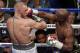 Floyd Mayweather Jr. hits Conor McGregor in a super welterweight boxing match Saturday, Aug. 26, 2017, in Las Vegas. (AP Photo/Eric Jamison)