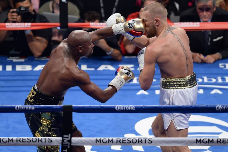 Floyd Mayweather finds Conor McGregor's nose with a left hand.