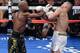 Aug 26, 2017; Las Vegas, NV, USA; Floyd Mayweather Jr. (black trunks) and Conor McGregor (white trunks) box during the sixth round of their boxing match at T-Mobile Arena. Mayweather won via tenth round TKO. Mandatory Credit: Joe Camporeale-USA TODAY Sports