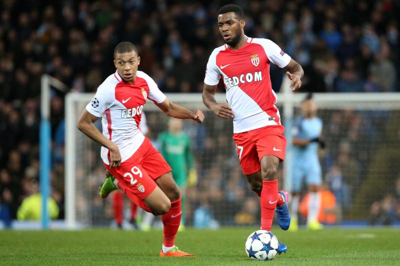 MANCHESTER, ENGLAND - FEBRUARY 21: Thomas Lemar of Monaco and Kylian Mbappe (left) in action during the UEFA Champions League Round of 16 first leg match between Manchester City FC and AS Monaco at Etihad Stadium on February 21, 2017 in Manchester, United Kingdom. (Photo by Jean Catuffe/Getty Images)