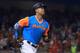 MIAMI, FL - AUGUST 25: Giancarlo Stanton #27 of the Miami Marlins hits a two run home run in the first inning during a game against the San Diego Padres at Marlins Park on August 25, 2017 in Miami, Florida. (Photo by Mike Ehrmann/Getty Images)
