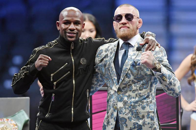 LAS VEGAS, NV - AUGUST 26: Floyd Mayweather Jr. (L) and Conor McGregor pose for pictures during a news conference after Mayweather's 10th-round TKO victory in their super welterweight boxing match on August 26, 2017 at T-Mobile Arena in Las Vegas, Nevada. (Photo by Ethan Miller/Getty Images)