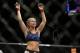 Paige VanZant celebrates after defeating Alex Chambers in their women’s straw weight mixed martial arts bout at UFC 191 on Saturday, Sept. 5, 2015, in Las Vegas. (AP Photo/John Locher)