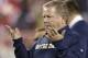 FILE - In this Oct. 31, 2015, file photo, Notre Dame head coach Brian Kelly gestures to his players as they warm up before an NCAA college football game against Temple, in Philadelphia. Kelly apologized to his players in the locker room after the loss at North Carolina State that he couldn’t find a way to win. “I’ve got to look hard at how I’m doing it to figure out a way to get a win for you guys, because you deserve it,” he said. (AP Photo/Mel Evans, File)