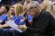 Leslie Alexander, owner of the Houston Rockets, looks over a stat sheet during the third quarter of the team's first-round NBA basketball playoff game against the Oklahoma City Thunder in Oklahoma City, Friday, April 21, 2017. Oklahoma City won 115-113. (AP Photo/Sue Ogrocki)
