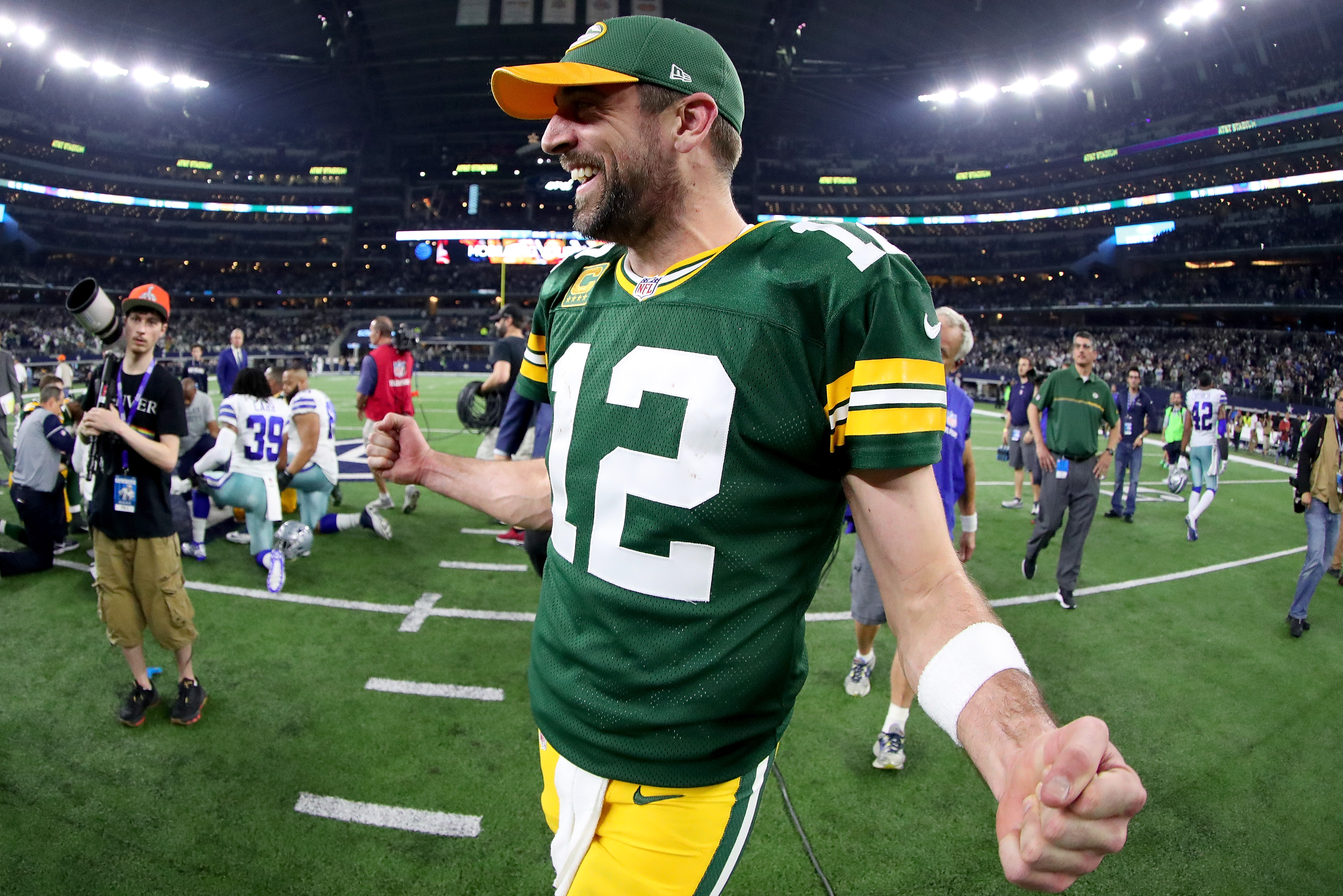 ARLINGTON, TX - JANUARY 15: Aaron Rodgers #12 of the Green Bay Packers celebrates after Mason Crosby #2 of the Green Bay Packers kicked the game winning field goal against the Dallas Cowboys in the final seconds of a NFC Divisional Playoff game at ATT Stadium on January 15, 2017 in Arlington, Texas. The Green Bay Packers beat the Dallas Cowboys 34-31 (Photo by Tom Pennington/Getty Images)