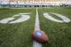 SEATTLE, WA - AUGUST 29: A football rest at the 50 yard line during the American Express 'Dinner on the 50,' exclusive to hundres of Seattle card holders and merchants, at CenturyLink Field on August 29, 2017 in Seattle, Washington. (Photo by Paul Conrad/Getty Images for American Express)