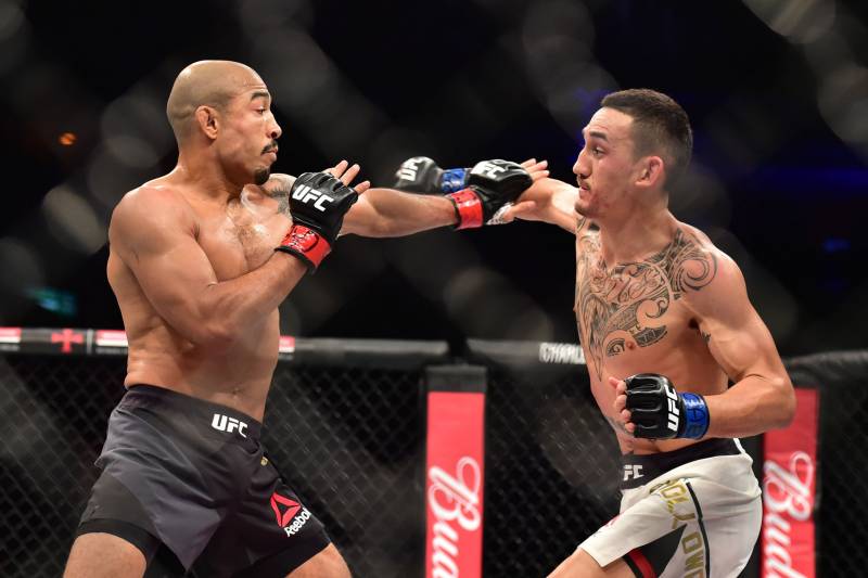 Jun 3, 2017; Rio de Janeiro, Brazil; Jose Aldo (red gloves) fights Max Hollway (blue gloves) during UFC 212 at Rio Olympic Arena. Mandatory Credit: Jason Silva-USA TODAY Sports