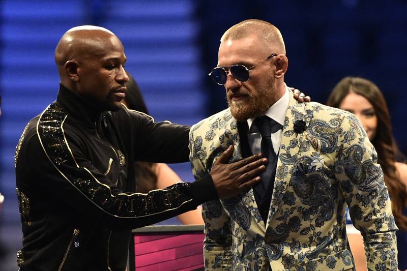 LAS VEGAS, NV - AUGUST 26: (L-R) Floyd Mayweather Jr. and Conor McGregor attend a news conference after Mayweather defeated Conor McGregor by 10th-round TKO in their super welterweight boxing match at T-Mobile Arena on August 26, 2017 in Las Vegas, Nevada. (Photo by Jeff Bottari/Zuffa LLC/Zuffa LLC via Getty Images)