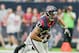 HOUSTON, TX - OCTOBER 30: C.J. Fiedorowicz #87 of the Houston Texans breaks tackle attempt by Tavon Wilson #32 of the Detroit Lions at NRG Stadium on October 30, 2016 in Houston, Texas. (Photo by Bob Levey/Getty Images)