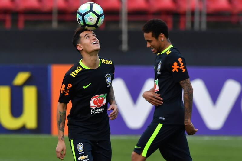 Brazil's team players Philippe Coutinho (L) and Neymar (R) take part in a training session at the Morumbi stadium in Sao Paulo, Brazil on March 25, 2017 ahead of a 2018 FIFA World Cup qualifier match against Paraguay on March 28 in Sao Paulo, Brazil. / AFP PHOTO / NELSON ALMEIDA (Photo credit should read NELSON ALMEIDA/AFP/Getty Images)