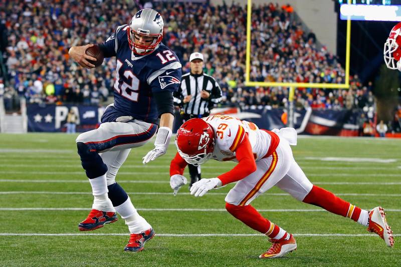FOXBORO, MA - JANUARY 16: Tom Brady #12 of the New England Patriots runs for the end zone against Husain Abdullah #39 of the Kansas City Chiefs in the first half during the AFC Divisional Playoff Game at Gillette Stadium on January 16, 2016 in Foxboro, Massachusetts. (Photo by Al Bello/Getty Images)