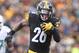 Jan 8, 2017; Pittsburgh, PA, USA; Pittsburgh Steelers running back Le'Veon Bell (26) rushes the ball against the Miami Dolphins during the second quarter in the AFC Wild Card playoff football game at Heinz Field. The Steelers won 30-12. Mandatory Credit: Charles LeClaire-USA TODAY Sports