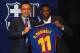 Barcelona's new player Ousmane Dembele (R) poses with his new jersey next to Barcelona's president Josep Maria Bartomeu at the Camp Nou stadium in Barcelona, during his official presentation at the Catalan football club, on August 28, 2017.
French starlet Ousmane Dembele agreed a five-year deal with Barcelona worth 105 million euros ($125 million) plus add-ons. Dembele, 20, moves from Borussia Dortmund, where he has been suspended since he boycotted training on August 10 in protest after the German club rejected Barca's first bid.
/ AFP PHOTO / LLUIS GENE (Photo credit should read LLUIS GENE/AFP/Getty Images)