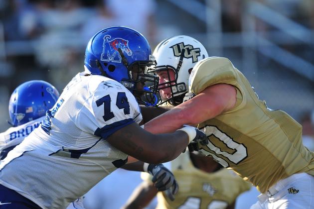 ORLANDO, FL - OCTOBER 03:  Offensive lineman Ken Anderson #74 of the Memphis Tigers blocks linebacker Josh Linam # 50 of the Central Florida Knights at Bright House Networks Stadium on  October 3, 2009 in Orlando, Florida  (Photo by Rick Dole/Getty Images)