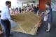 Carla Perroni Aguilera of Miami Beach, Fla., holds a cart as her husband Ronald Aguilera and her father Joe Perroni load sheets of plywood at The Home Depot store in North Miami, Fla., Wednesday, Sept. 6, 2017. Florida residents are preparing for the possible landfall of Hurricane Irma, the most powerful Atlantic Ocean hurricane in recorded history. (AP Photo/Marta Lavandier)