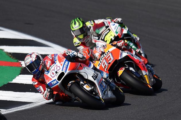 Ducati Team's Italian rider Andrea Dovizioso leads Repsol Honda Team's Spanish rider Marc Marquez during the MotoGP race of the British Grand Prix at Silverstone circuit in Northamptonshire, southern England, on August 27, 2017. / AFP PHOTO / Oli SCARFF (Photo credit should read OLI SCARFF/AFP/Getty Images)
