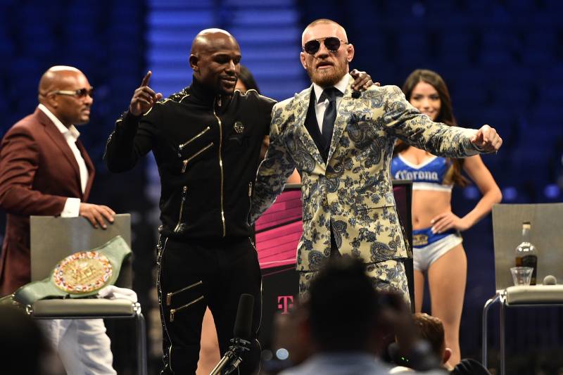 LAS VEGAS, NV - AUGUST 26: (L-R) Floyd Mayweather Jr. and Conor McGregor attend a news conference after Mayweather defeated Conor McGregor by 10th-round TKO in their super welterweight boxing match at T-Mobile Arena on August 26, 2017 in Las Vegas, Nevada. (Photo by Jeff Bottari/Zuffa LLC/Zuffa LLC via Getty Images)