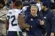 EAST RUTHERFORD, NJ - FEBRUARY 02: Head Coach Pete Carroll of the Seattle Seahawks shakes the hand of Michael Bennett #72 as Bennett walks off the field against the Denver Broncos during Super Bowl XLVIII on February 2, 2014 at MetLife Stadium in East Rutherford, New Jersey. The Seahawks won the game 43-8. (Photo by Focus on Sport/Getty Images)
