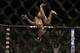 Demetrious Johnson flips during his main event fight with Chris Cariaso, Saturday, Sept. 27, 2014, in Las Vegas. Johnson won via submission. (AP Photo/John Locher)