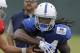 Indianapolis Colts quarterback Scott Tolzien hands off to running back Matt Jones during an NFL football practice, Wednesday, Sept. 6, 2017, in Indianapolis. (AP Photo/Darron Cummings)