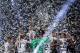 Real Madrid's team players celebrate with the trophy under confetti during a celebration event held at the Santiago Bernabeu stadium after the team won the the UEFA Champions League football match final Juventus vs Real Madrid CF held at the National Stadium of Wales in Cardiff on June 3, 2017. / AFP PHOTO / OSCAR DEL POZO (Photo credit should read OSCAR DEL POZO/AFP/Getty Images)