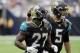Jacksonville Jaguars running back Leonard Fournette (27) and quarterback Blake Bortles (5) run off the field during the second half of an NFL football game against the Houston Texans Sunday, Sept. 10, 2017, in Houston. (AP Photo/David J. Phillip)