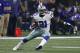 Dallas Cowboys running back Ezekiel Elliott (21) carries the ball for extra yardage against the New York Giants in the second half of an NFL football game, Sunday, Sept. 10, 2017, in Arlington, Texas. (AP Photo/Ron Jenkins)