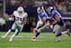 ARLINGTON, TX - SEPTEMBER 10: Ezekiel Elliott #21 of the Dallas Cowboys carries the ball against B.J. Goodson #93 of the New York Giants and Romeo Okwara #78 of the New York Giants in the fourth quarter at AT&T Stadium on September 10, 2017 in Arlington, Texas. (Photo by Tom Pennington/Getty Images)