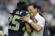 Seattle Seahawks cornerback Richard Sherman hugs Rocky Seto before the NFL Super Bowl XLIX football game Sunday, Feb. 1, 2015, in Glendale, Ariz. (AP Photo/Ben Margot)