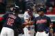 Cleveland Indians' Jose Ramirez gets congratulations from Francisco Lindor (12) after hitting a two run home run off Detroit Tigers starting pitcher Myles Jaye as catcher James McCann stands in the background during the fourth inning in a baseball game, Monday, Sept. 11, 2017, in Cleveland. (AP Photo/Ron Schwane)
