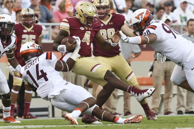 BLACKSBURG, VA - SEPTEMBER 17: Linebacker Tavante Beckett #14 of the Virginia Tech Hokies tackles quarterback Darius Wade #4 of the Boston College Eagles in the second half at Lane Stadium on September 17, 2016 in Blacksburg, Virginia. Virginia Tech defeated Boston College 49-0. (Photo by Michael Shroyer/Getty Images)