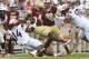 BLACKSBURG, VA - SEPTEMBER 17: Linebacker Tavante Beckett #14 of the Virginia Tech Hokies tackles quarterback Darius Wade #4 of the Boston College Eagles in the second half at Lane Stadium on September 17, 2016 in Blacksburg, Virginia. Virginia Tech defeated Boston College 49-0. (Photo by Michael Shroyer/Getty Images)