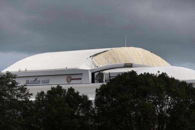 Part of the Retractible roof's membrane at Miami's Marlins Park stadium, where the Miami Marlins play baseball, is seen peeled off Monday, Sept. 11, 2017, in the wake of Hurricane Irma. (AP Photo/Wilfredo Lee)