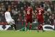 Sevilla's Joaquin Correa, left, scores a goal during the Champions League group E soccer match between Liverpool and Sevilla at Anfield stadium in Liverpool, England, Wednesday, Sept. 13, 2017. (AP Photo/Frank Augstein)