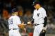 NEW YORK, NY - JULY 07: Dellin Betances #68 of the New York Yankees hands the ball to manager Joe Girardi #28 as he leaves a game against the Oakland Athletics in the tenth inning at Yankee Stadium on July 7, 2015 in the Bronx borough of New York City. (Photo by Jim McIsaac/Getty Images)