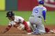 Cleveland Indians' Francisco Lindor, left, slides safely into second base for a steal as Kansas City Royals' Whit Merrifield is late with the tag in the fifth inning of a baseball game, Friday, Sept. 15, 2017, in Cleveland. (AP Photo/David Dermer)