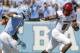 FILE - In this Sept. 9, 2017, file photo, Louisville quarterback Lamar Jackson (8) runs the ball as North Carolina's Tomon Fox (12) chases him during the first half of an NCAA college football game, in Chapel Hill, N.C. Fourteenth-ranked Louisville is looking for defensive improvement against No. 3 Clemson along with big numbers by quarterback Lamar Jackson on Saturday. (AP Photo/Gerry Broome, File)